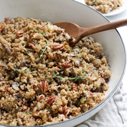 finished quinoa pilaf with wooden serving spoon