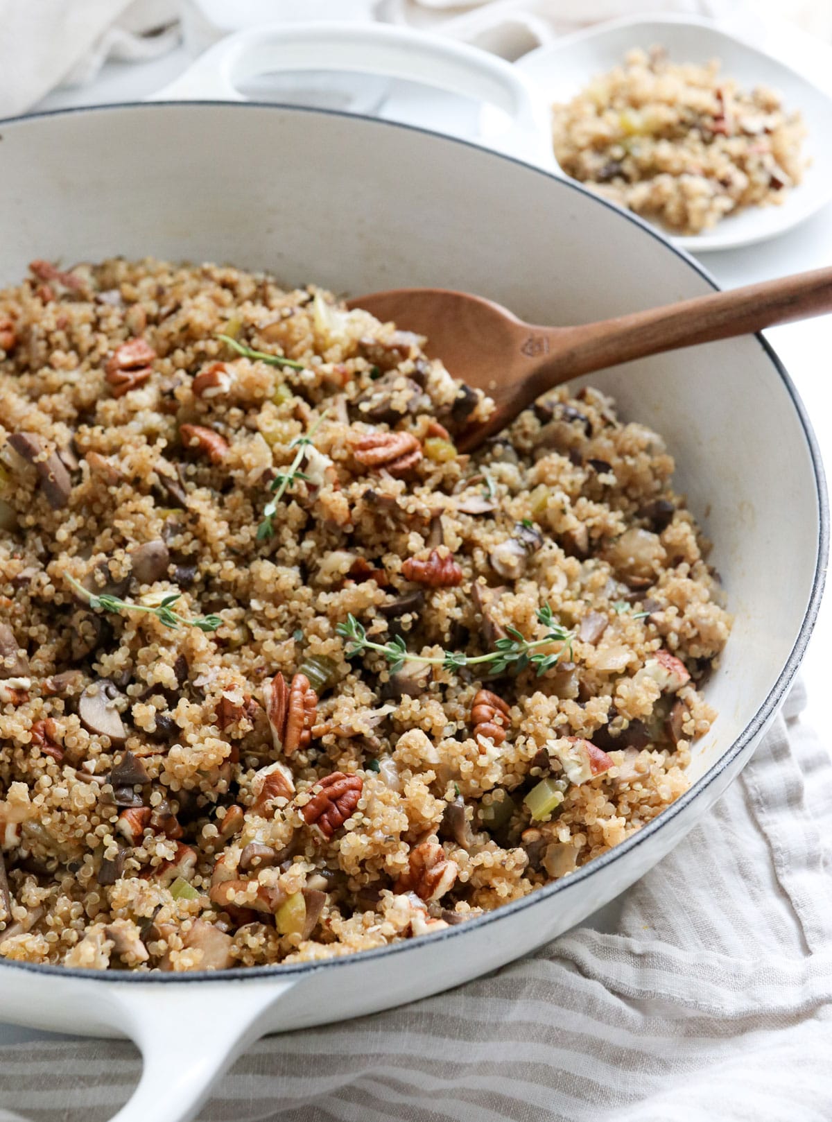 finished quinoa pilaf with wooden serving spoon