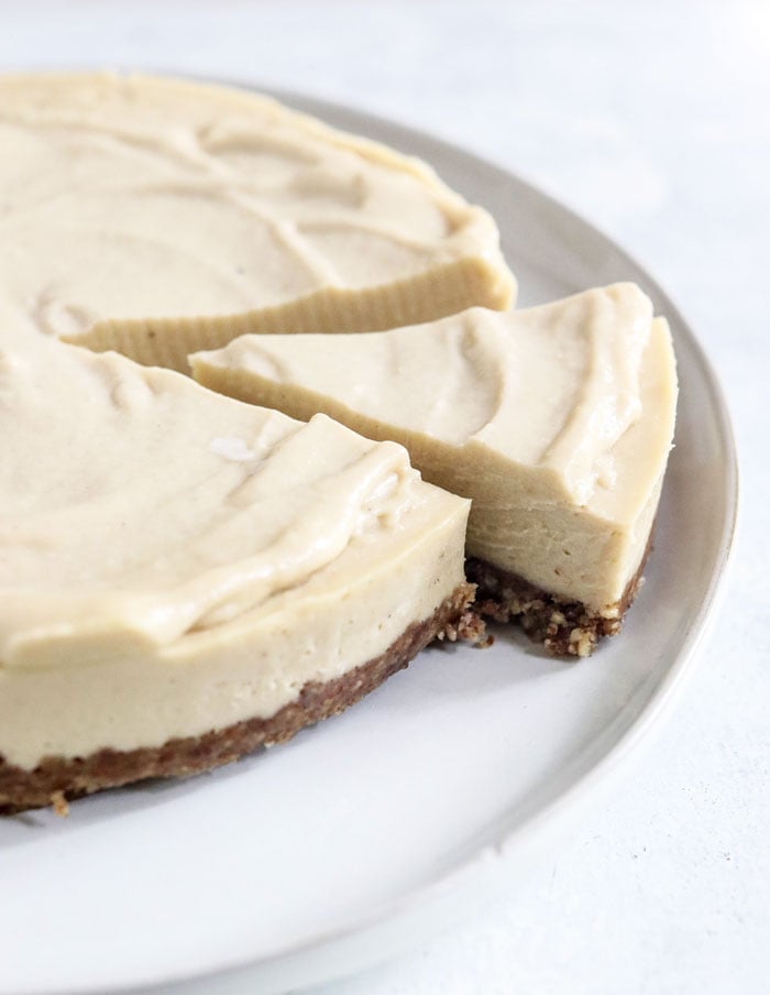 whole vegan cheesecake with slice taken out