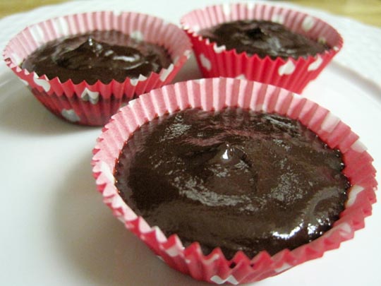 top layer of chocolate added to cupcake liners 