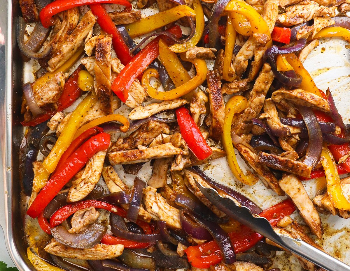 chicken fajitas with veggies on a sheet pan. 