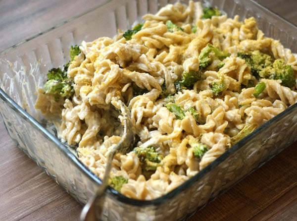 vegan mac'n cheese with broccoli in a serving dish