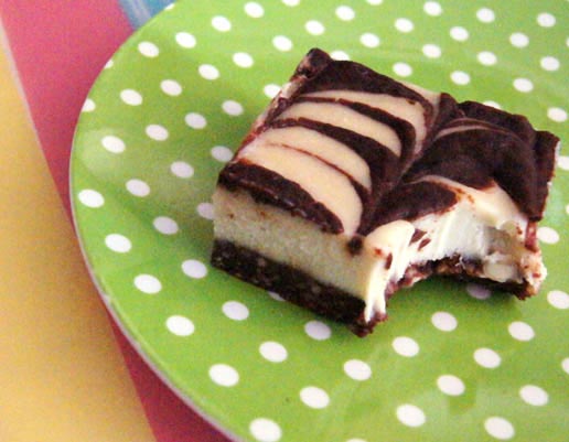 chocolate swirl cheesecake bar on a plate