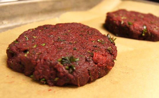 beet burger patty on baking sheet with parchment paper 