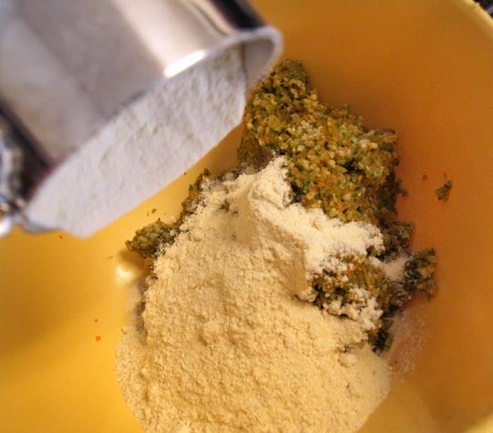 adding millet flour to veggie mixture