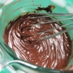 chocolate mousse being whisked in measuring cup