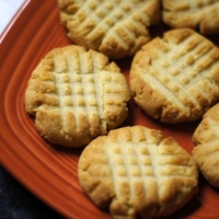 closeup of grain free shortbread cookies on a red plate