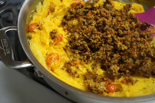 veggie crumbles over baked spaghetti squash with Roasted Red Pepper "Cream" sauce.