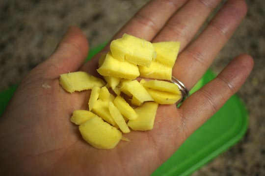 hand holding cut ginger
