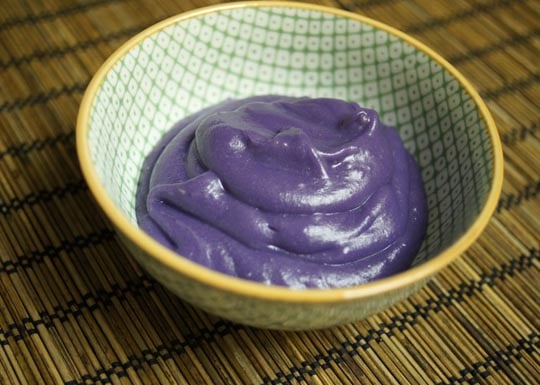 Korean Purple Yam & Ginger Pudding in green and yellow bowl 