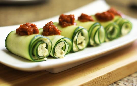 cucumber roll ups with sun dried tomatoes on top