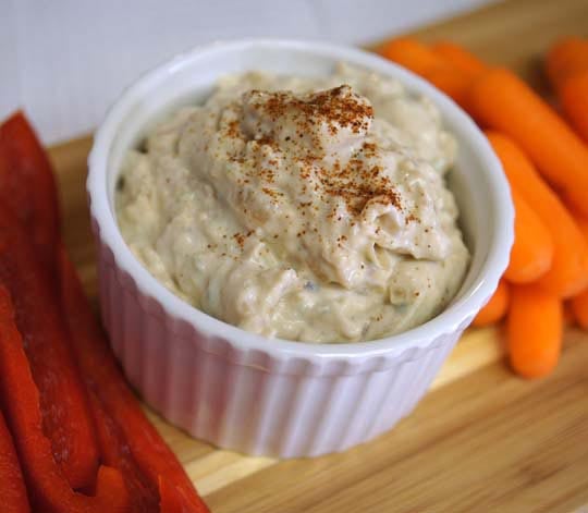 "Sour Cream" & Caramelized Onion Dip in a small white bowl