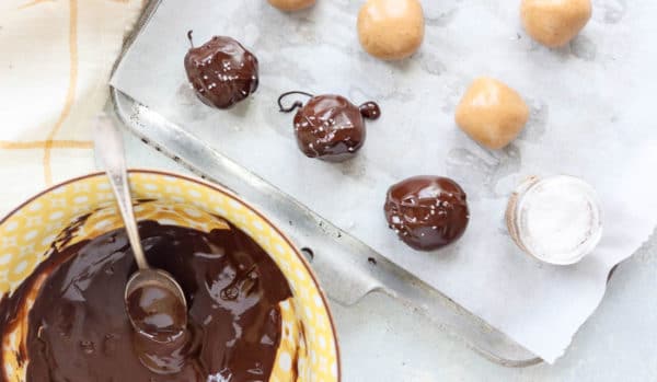 peanut butter balls with melted chocolate