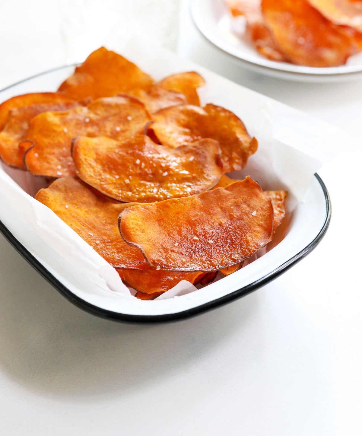 sweet potato chips from the side in a white bowl