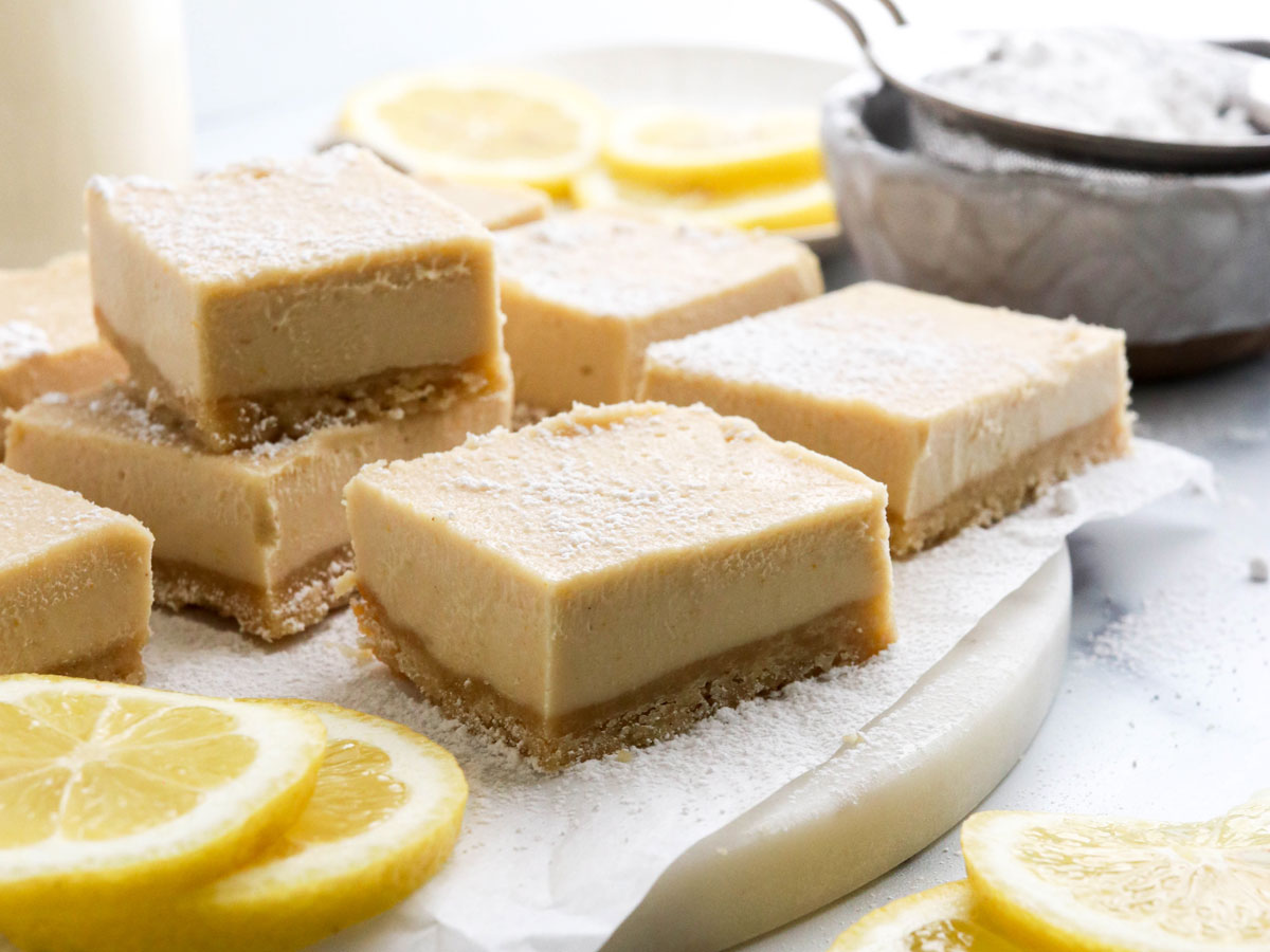 vegan lemon bars with crust and powdered sugar
