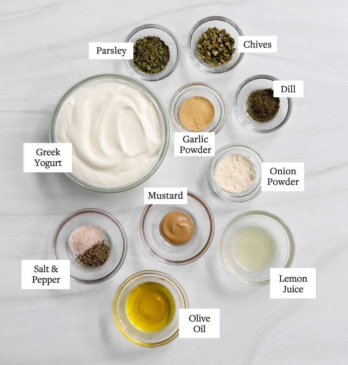 greek yogurt dressing ingredients labeled in bowls.