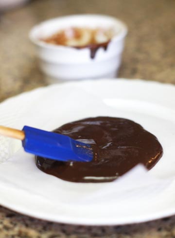spreading out chocolate with a spatula