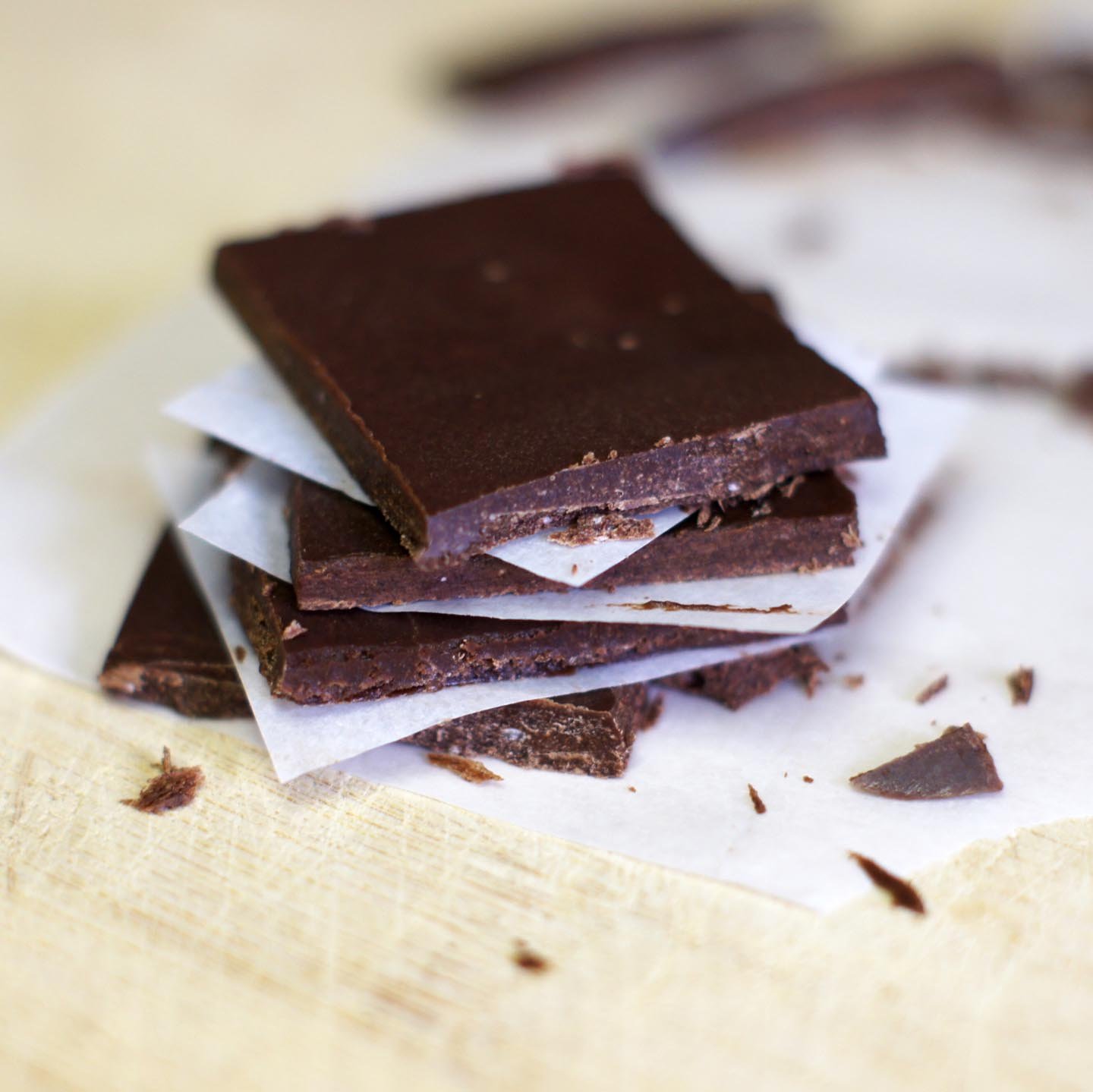 squares of raw chocolate bark stacked on top of each other