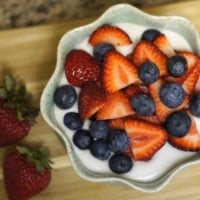 Coconut cream pudding topped with berries