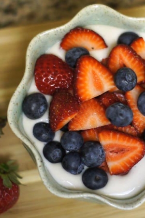 Coconut cream pudding topped with berries