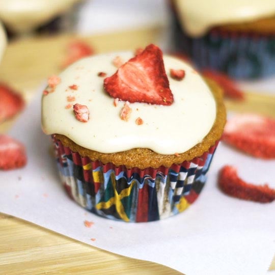 strawberry cupcake with frosting and freeze dried strawberries on top