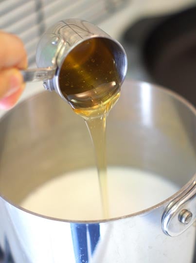 pouring honey into the coconut milk