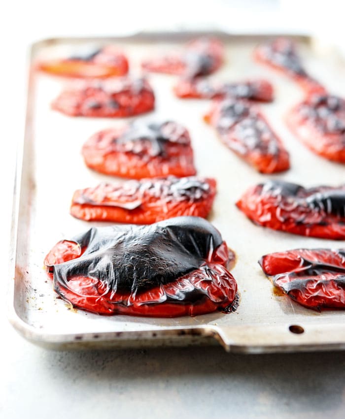 roasted red peppers on baking sheet