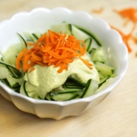 Oil free green goddess dressing on shaved cucumbers with grated carrots