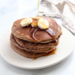 paleo pancakes with banana slices on top