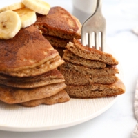 fork in a stack of paleo pancakes