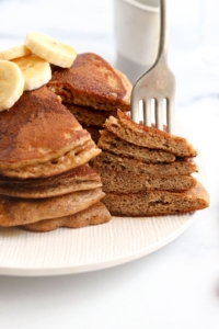fork in a stack of paleo pancakes