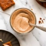 maple pecan glaze in a glass jar near pumpkin bars.