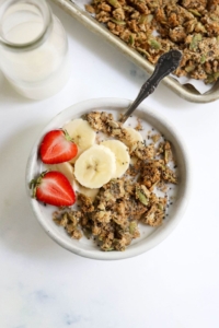 pumpkin seed granola in bowl with fruit on top