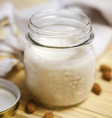 homemade almond milk in a small mason jar
