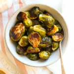 balsamic brussels sprouts served in a small bowl with spoon.