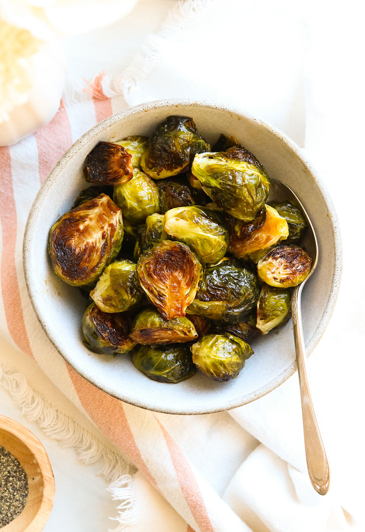 balsamic brussels sprouts served in a small bowl with spoon.