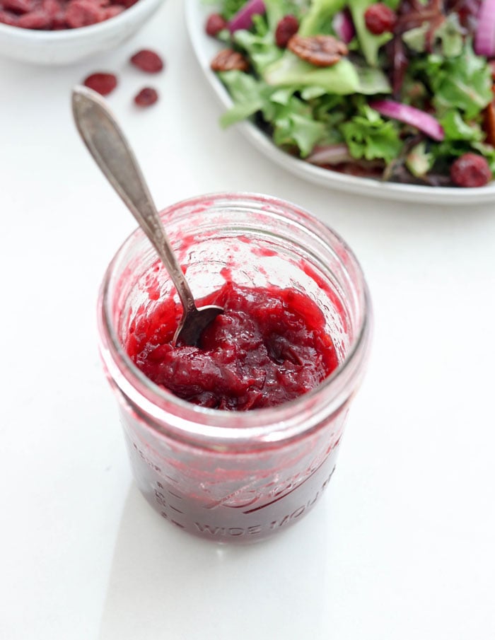 cranberry sauce in a jar with salad ingredients