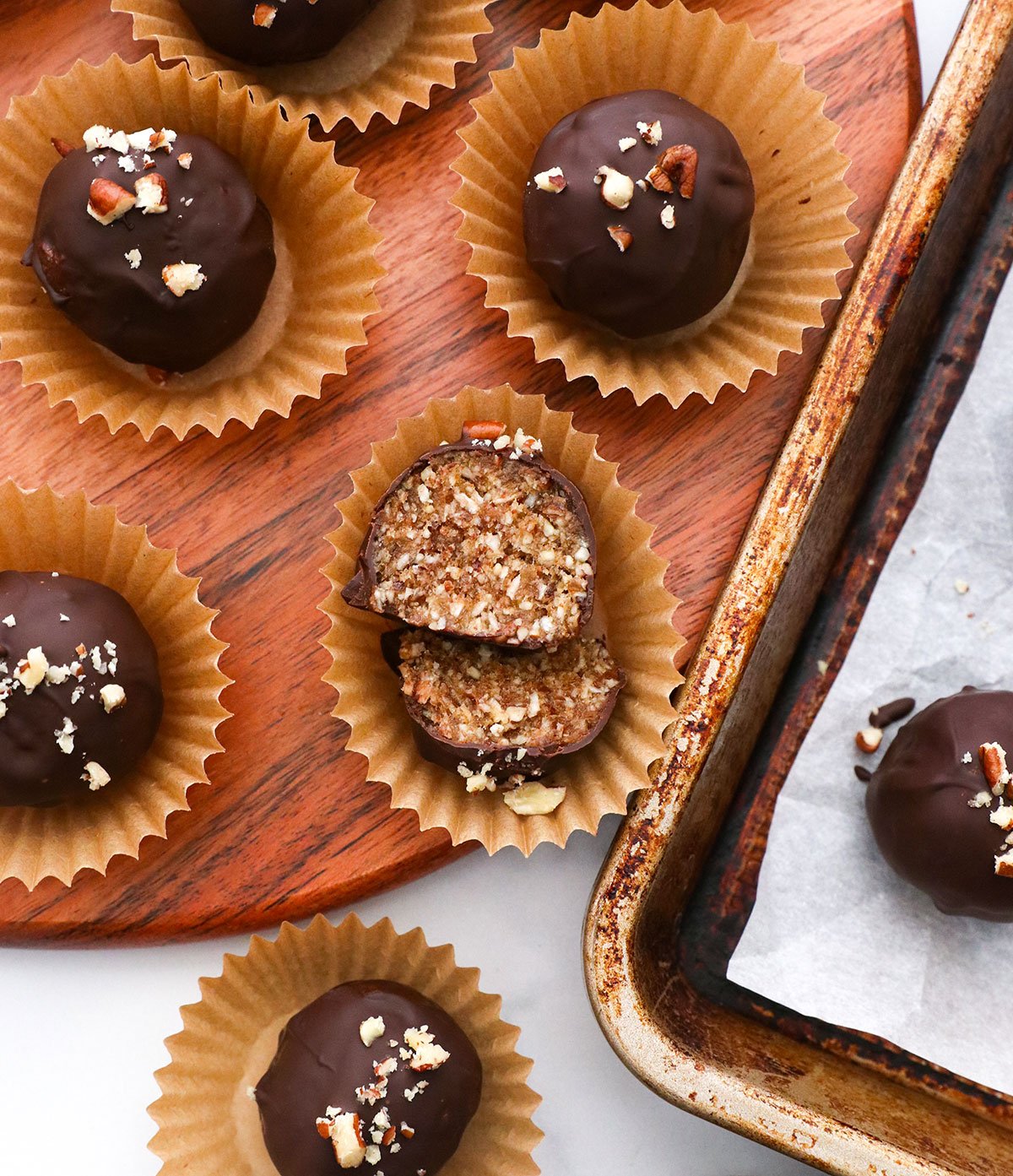 pecan pie truffle cut in half to show the inner texture. 