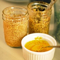 homemade spicy mustard in glass jars and ramekin