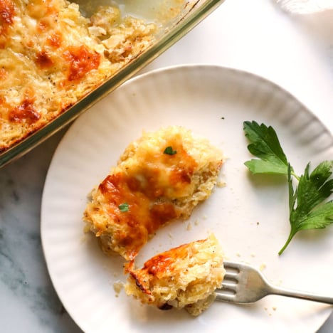slice of spaghetti squash casserole cut with a fork on a plate.