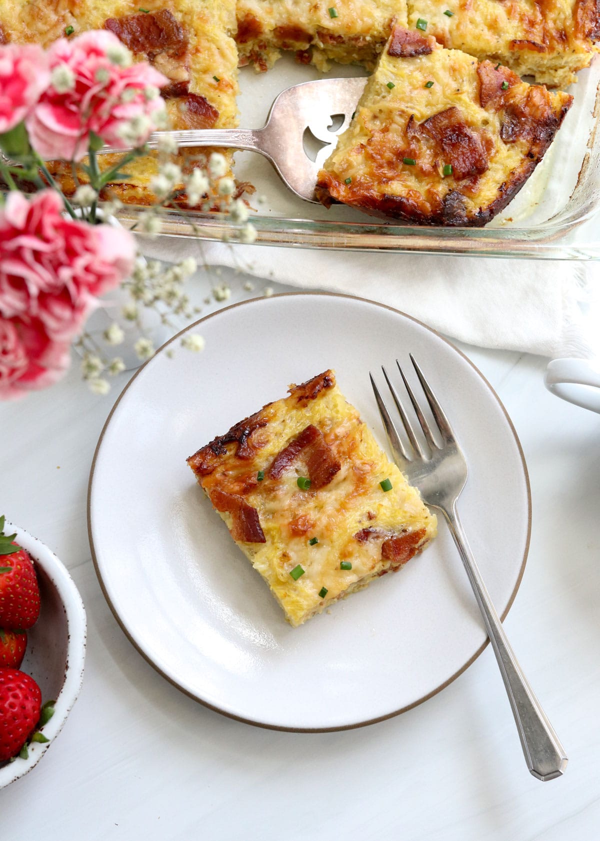 slice of breakfast casserole served on plate.