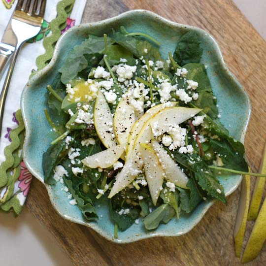 kale, pear, and feta salad in a bowl