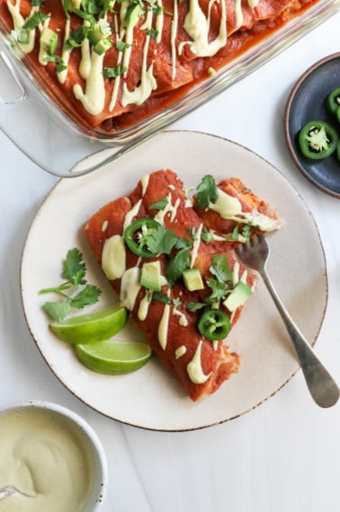sweet potato enchiladas on plate with fork