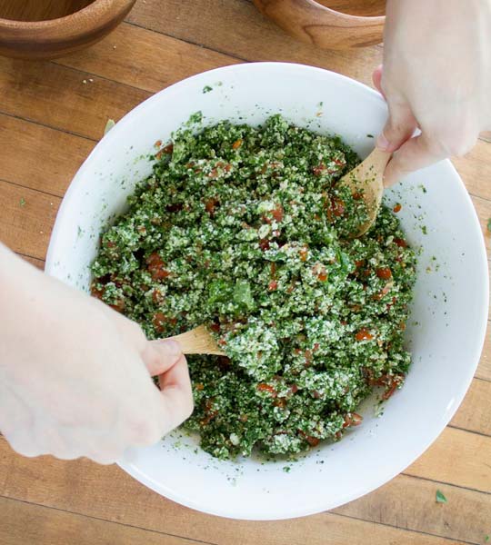 Raw Cauliflower Tabouli being mixed in a bowl