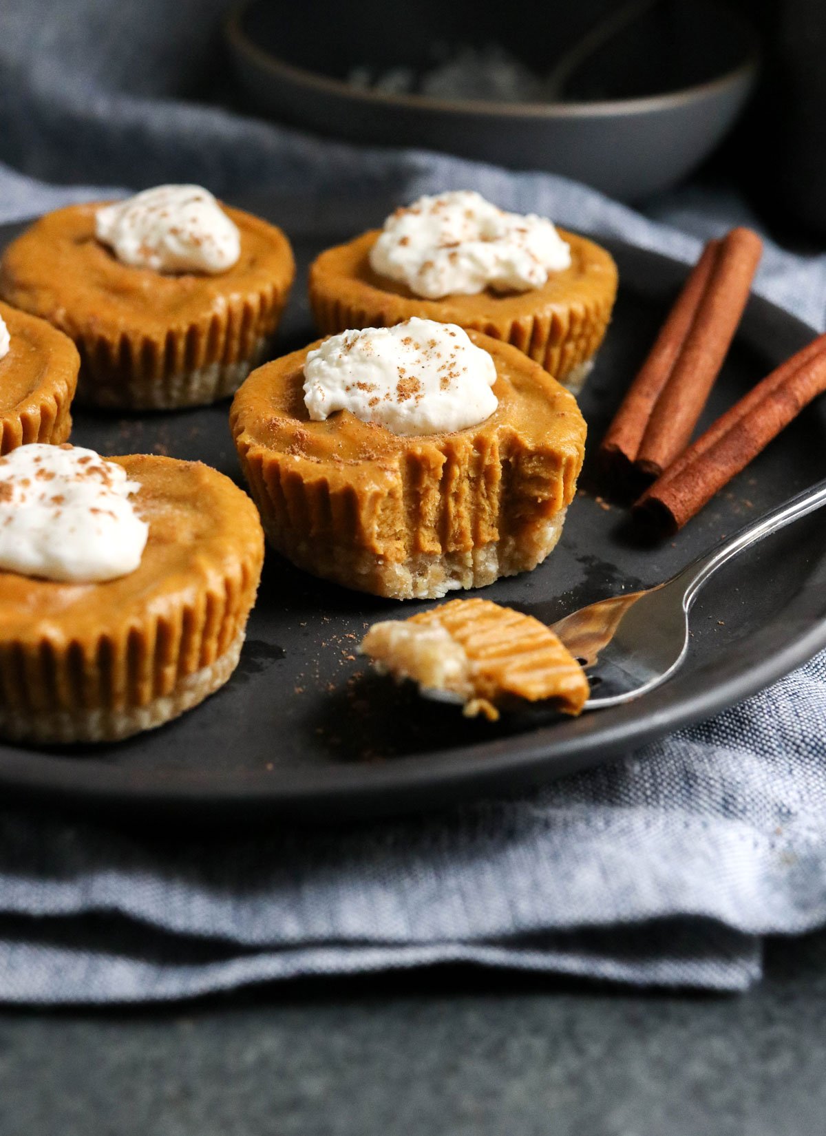 vegan pumpkin tarts on black plate