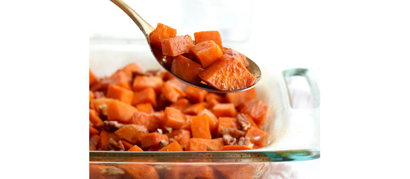 glazed sweet potatoes on serving spoon