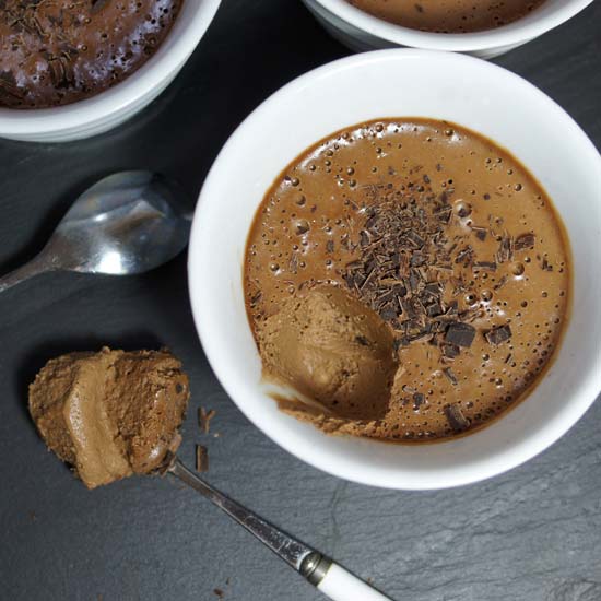 chocolate pots de creme in a bowl with chocolate shavings on top
