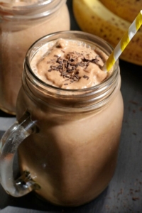chocolate smoothie in glass with straw