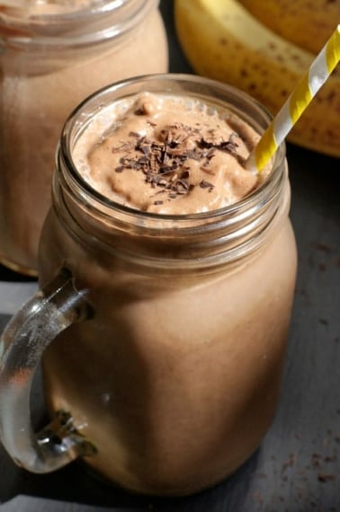 chocolate smoothie in glass with straw