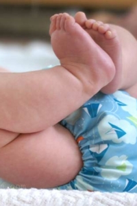 baby in reusable cloth diaper